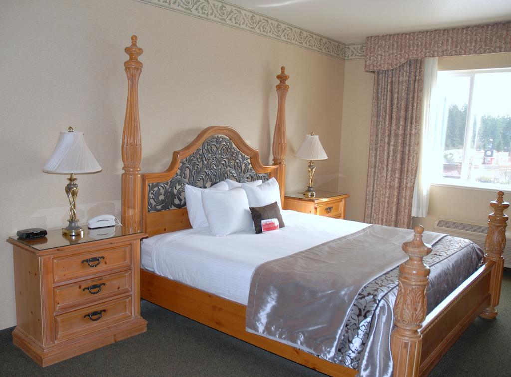 ホテル ラマダ バイ ウィンダム オリンピア 部屋 写真 A bedroom at the Best Western Premier Hotel at Grand Country